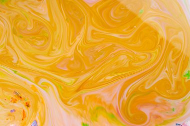 Sıvı Sanat. Soyut bulanık arkaplan rengi. Hint desenli canlı sarı asit, turuncu ve yeşil