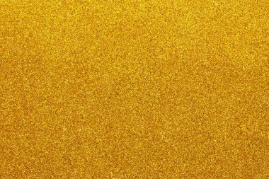 Işıldayan metalik yüzeyi ve kopyalama alanı ile parıldayan altın parıltılı arkaplan dokusu