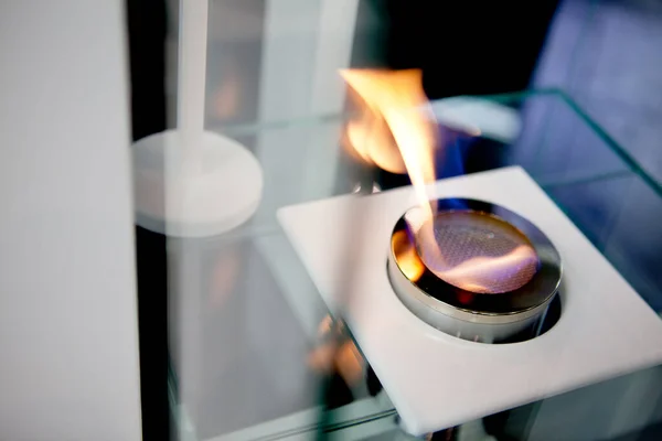 Bioethanol fueled portable fireplace burning at home, for live fire at home, no chimney and mantelpiece is needed. Liquid bio ethanol burns in cup. — Stock Image Bioethanol Fueled Portable Fireplace Burning Home Live Fire Home Chimney Stock Image
