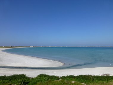 View across Gott Bay, Isle of Tiree, Scotland on a sunny summer's day clipart