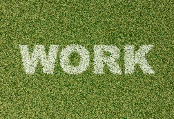 WORK - трав'яні літери на футбольному полі — стокове фото
