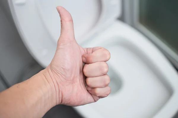 Thumb Up with background cleaning Toilets — Stockfoto