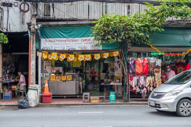 vegetarian food stall with yellow flag with symbols of eat for merit, no animal meat sign at Yaowarat J Festival Bangkok Chinatown street.18 October 2020, Bangkok,THAILAND.