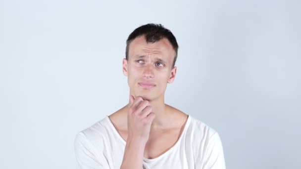 Thoughtful man , Caucasian Young Man thinking  and considering a decision — Stock Video