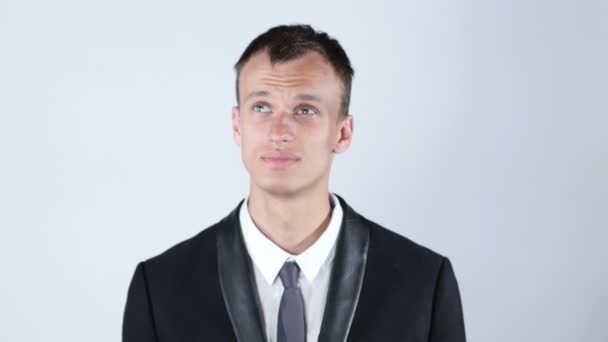 Portrait of handsome young thoughtful man isolated over white background — Stock Video