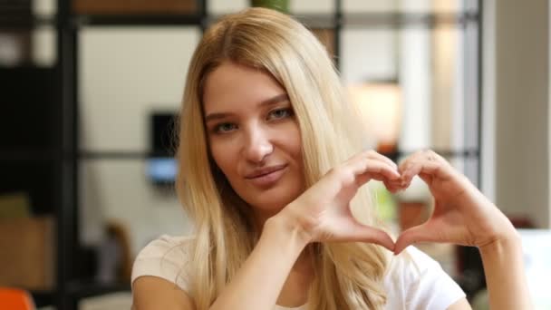 Girl Showing Heart, made by hands — стоковое видео