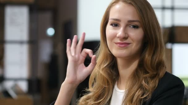 Okay, Sign of Satisfaction by  Smiling Beautiful Girl Sitting Indoor — Stock Video