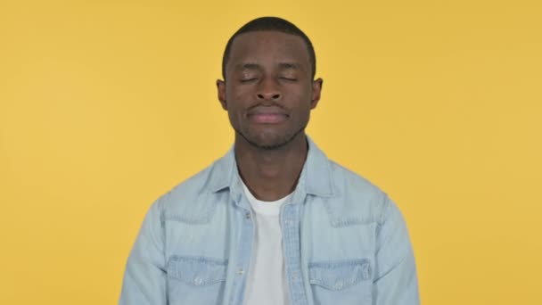 Young African Man with Thumbs Down, Yellow Background — Stock Video