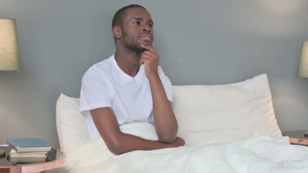 Pensive Young African Man Thinking in Bed — Stock Video