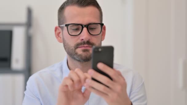 Portrait of Middle Aged Man using Smartphone — Stock Video