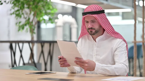 Hardworking Arab Businessman Reading Documents