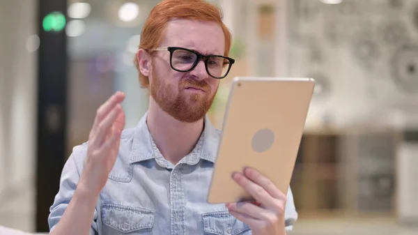 Upset Young Redhead Man reacting to Loss on Tablet — Stock Photo, Image