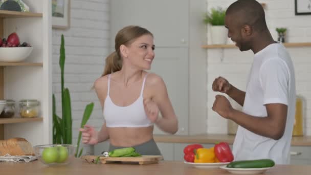 Sporty African Man and Woman Dancing in Kitchen — Stock Video