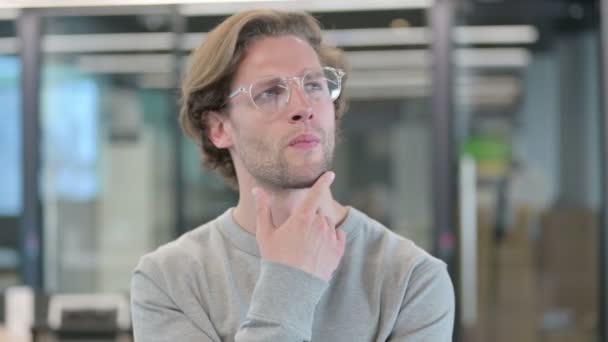 Portrait of Pensive Young Businessman Thinking — Stock Video