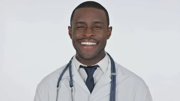 African Doctor Smiling at Camera, White Background — Stock Photo, Image