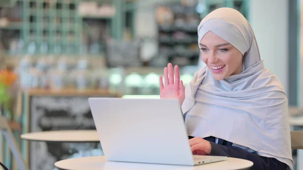 Modest Arab Woman doing Video Call on Laptop