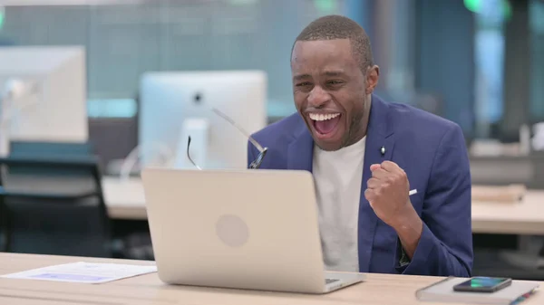 Successful Young African Businessman Celebrating on Laptop at Work — Stockfoto
