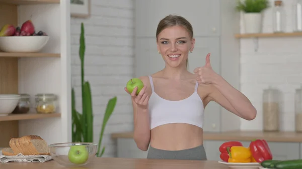 Woman Making Heart Shape by Hands while in Kitchen — Stock Photo, Image