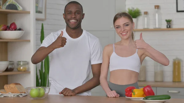 Woman and African Man Showing Thumbs Up Sign — Stock Photo, Image