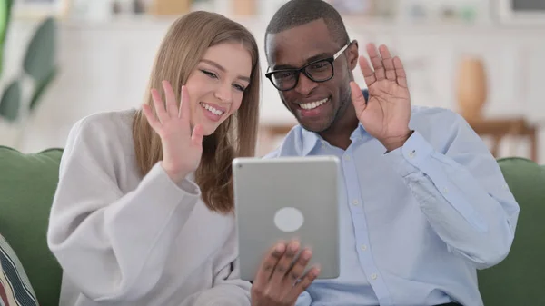 Online Video Chat on Tablet by Interracial Couple, Home — Stock Photo, Image