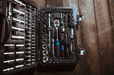 Toolbox on the wooden floor. View from above
