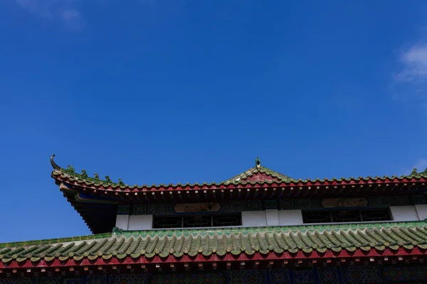 Roof of ancient Chinese Architecture, Old building under blue sky.