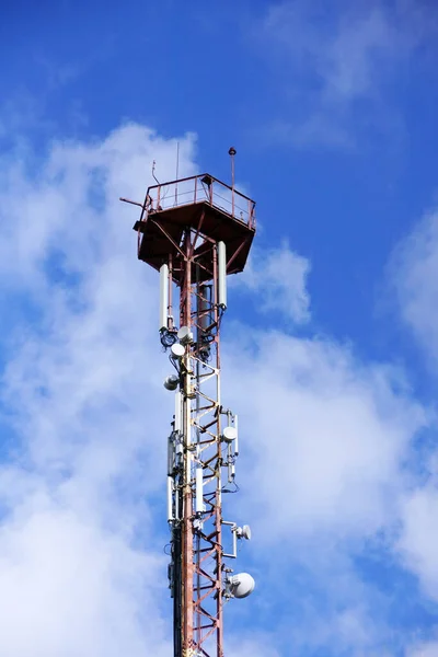 Communication tower 3G or 4G network telephone cellsite silhouette on blue sky. Implementation of communication standard 5G