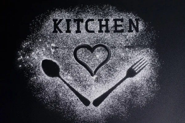 Images of forks and spoons on a white flour background. Lettering-kitchen and drawing a heart on top.