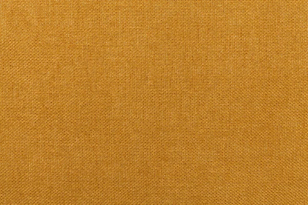 Naranja oscuro, fondo ocre de un material textil. Tejido con textura natural. Contexto . — Foto de Stock