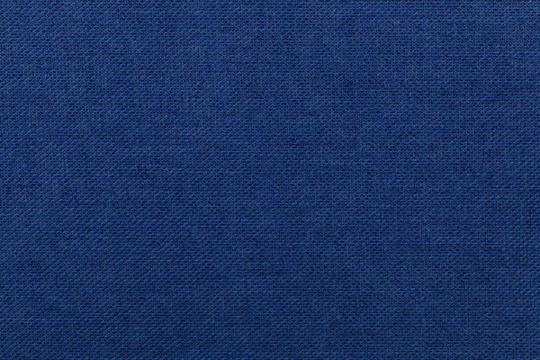 Dunkelblauer Hintergrund aus Textilmaterial. Stoff mit natürlicher Textur. — Stockfoto