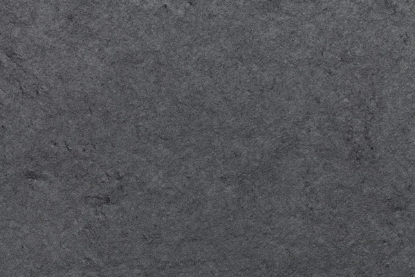 Dunkelgrauer Hintergrund aus Naturschiefer. Textur Nahaufnahme aus schwarzem Stein. — Stockfoto