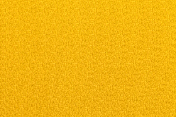 Fundo ocre amarelo claro de uma matéria têxtil. Tecido com textura natural. Contexto . — Fotografia de Stock