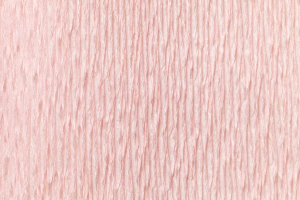 Textural fondo rosa claro de papel ondulado ondulado, primer plano . — Foto de Stock