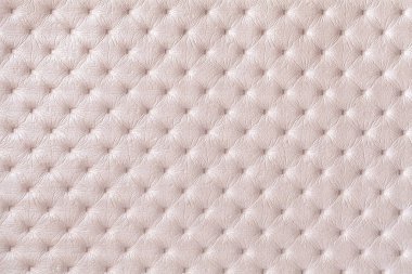 Texture of pearl beige leather background with capitone pattern, macro. Cream textile of retro Chesterfield style. Vintage fabric backdrop. clipart