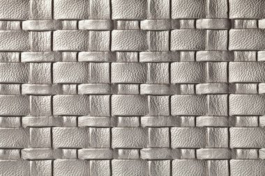 Hasır desenli gri ve gümüş deri arka plan, makro. Modern dekoratif tekstil tasarımlarından soyut arkaplan.