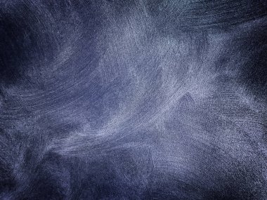 Dekoratif alçı lacivert renkli eski duvar dokusu. Çatlamış grunge arkaplan ve vignette. Soyut kot taşı sıva yüzeyi, yakın plan..