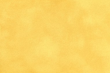 Süet kumaştan açık sarı bir arka plan, yakın plan. Kusursuz altın tekstilin kadife dokusu, makro. Ocher 'ın yapısı tuval arkaplanı.
