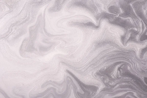 Abstract fluid art background light silver and white colors. Liquid marble. Acrylic painting on canvas with gray shiny gradient. Alcohol ink backdrop with pearl wavy pattern.
