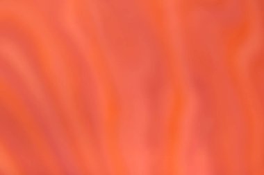 Dalgalı kıvrımlı desenli parlak turuncu ve kırmızı arka plan. Odaklanmamış sanat soyut kızıl gradyan arkaplan bulanık ve bokeh ile. İpek tekstil.