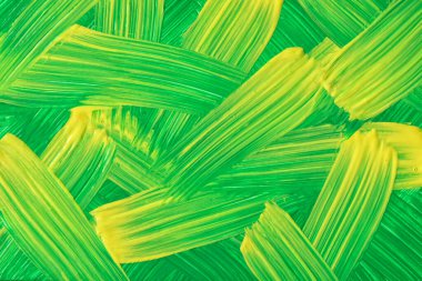 Soyut sanat arka planı koyu yeşil ve sarı renkler. Tuval üzerine suluboya boya, fırça darbeleri ve sıçramalarla. Benekli şekilli akrilik çizimler. Doku arkaplanı.