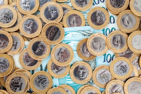 Brasileiro 1 Moedas reais e notas bancárias de 100 reais — Fotografia de Stock