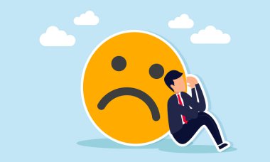 Sad frustrated businessman sitting leaning on a sad emoticon illustration of failure in completing a business project