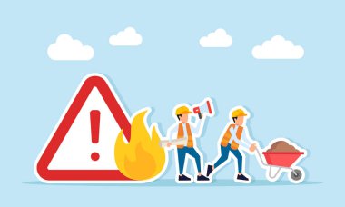 Mühendis megafon kullanarak işçilere yol tarifi veriyor. Kum arabasını yanan uyarı levhasından uzaklaştırıyor. İnşaat projesinde güvenlik talimatı veriliyor.