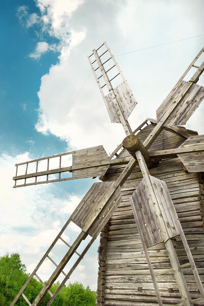 Wooden mill in outdoor ukrainian national falk historical village in Kiev