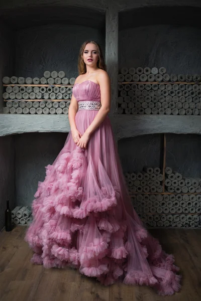 Portrait of young beautiful girl in long pink dress — Stock Photo, Image