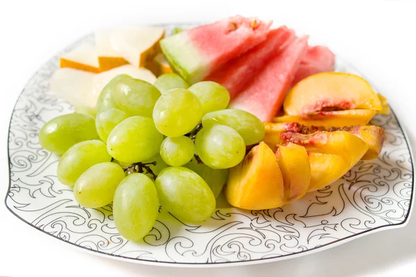 Brzoskwinia, białych winogron, arbuza i melona na talerzu — Zdjęcie stockowe