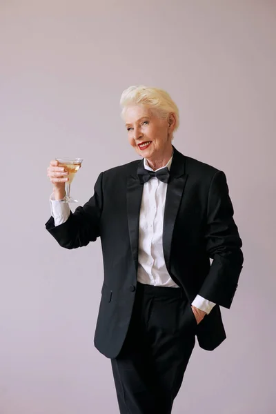 Stylish Mature Sommelier Senior Woman Tuxedo Glass Sparkling Wine Fun — Stock Photo, Image