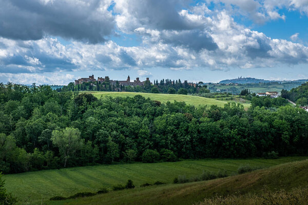 Trekking in Certaldo, panoramic view among the cypresses from the Canonica park to discover the gullies of Casale, a landscape with erosive phenomena with a final visit to the ancient village of Certaldo, province of Florence, Tuscany - Italy