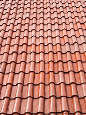 Kırmızımsı kahverengi terracotta çatı kiremitlerinin deseni.