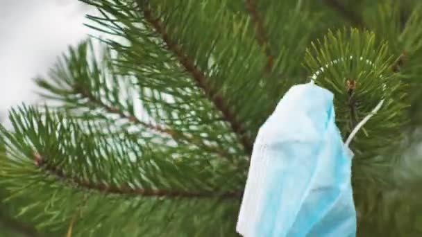 Medical Disposable Blue Protective Mask Floats Wind Pine Bristles Coronavirus — Stock Video